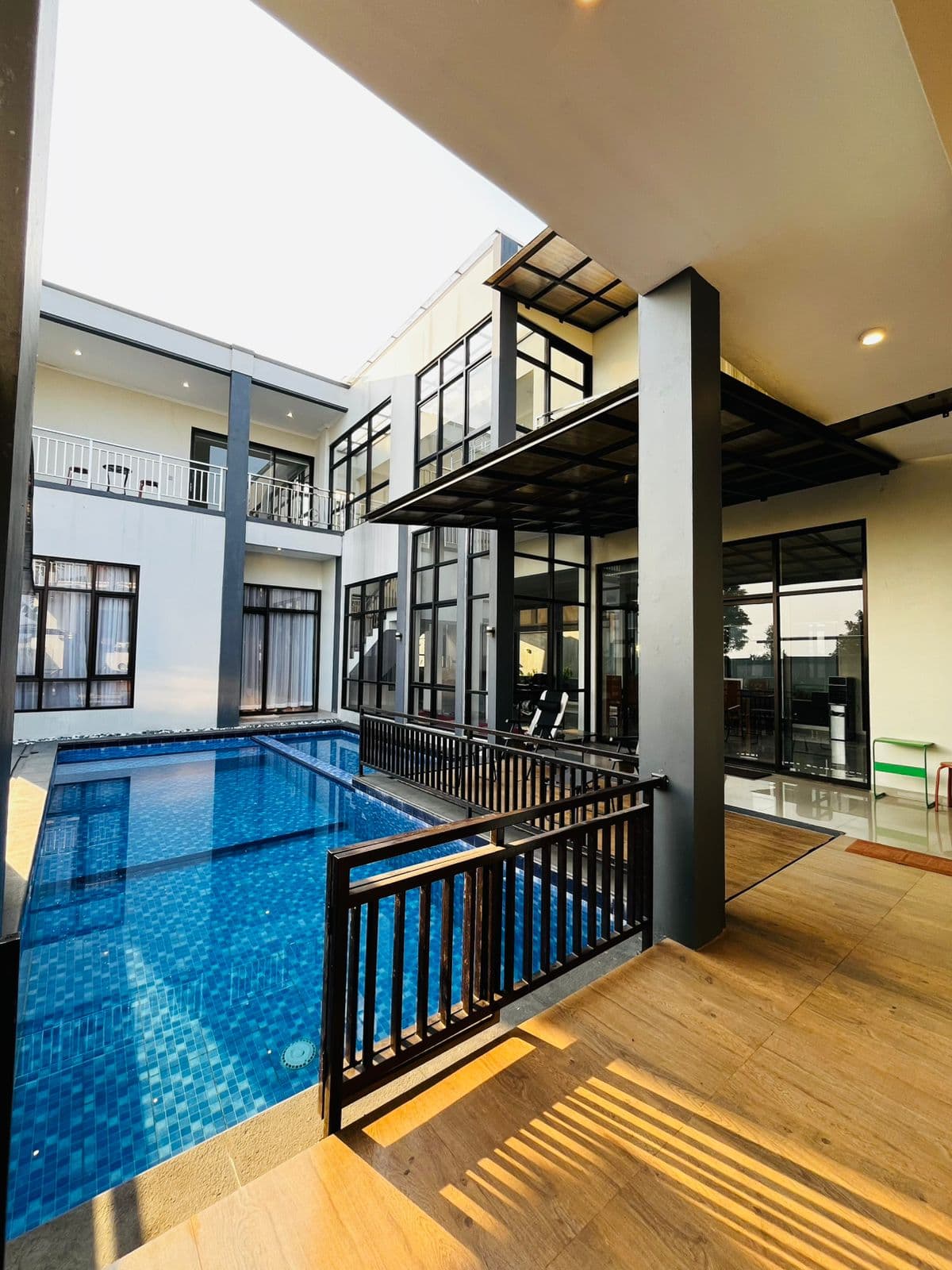 The pool courtyard seen from the villa's upper walkway