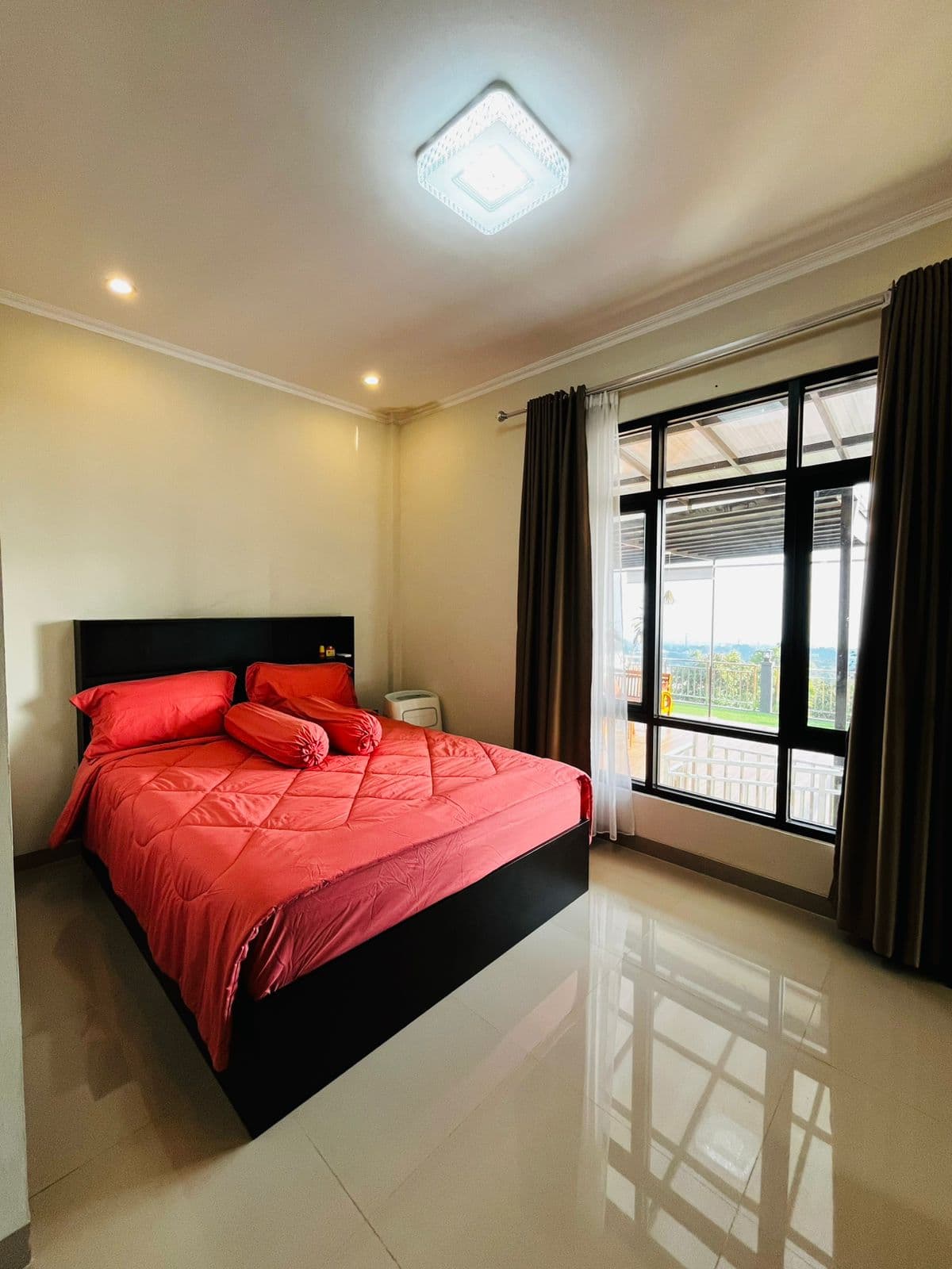 Bedroom with a window looking out to the hills